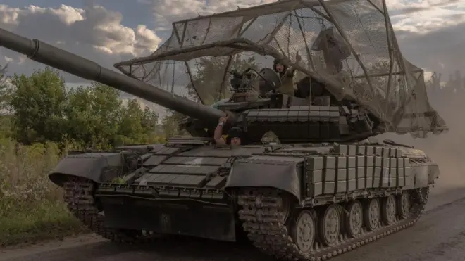 Ukrainian servicemen drive a Soviet-made T-64 tank in the Sumy region, near the border with Russia, on August 11, 2024, 