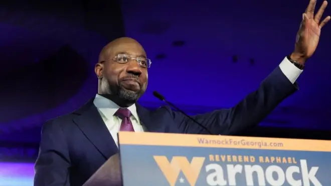 U.S. Senator Raphael Warnock (D-GA) speaks during an election night party after a projected win in the U.S. midterm runoff election