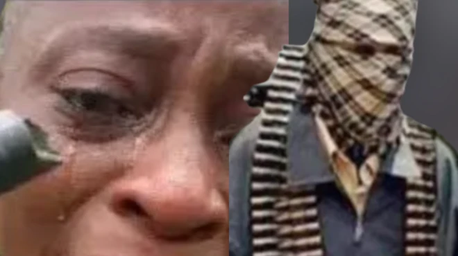 Oju ọga ile ẹkọ girama Esinele pẹlu ibọn ti wọn gbe si i loju, ati agbesunmọmi to fi aṣọ boju