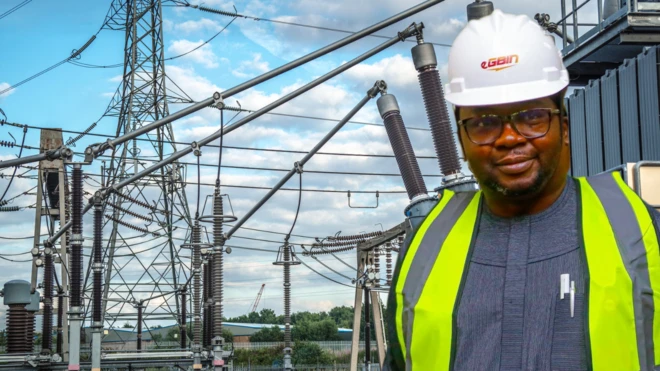 Bayo Adelabu wearing lemon jacket while transformer dey im back