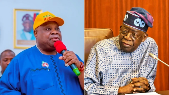 man on yellow cap wit red mic and blue cloth look front, and man wey wear cap fold hand dey im side.
