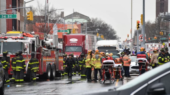 First responders crowd the streets near the subway station