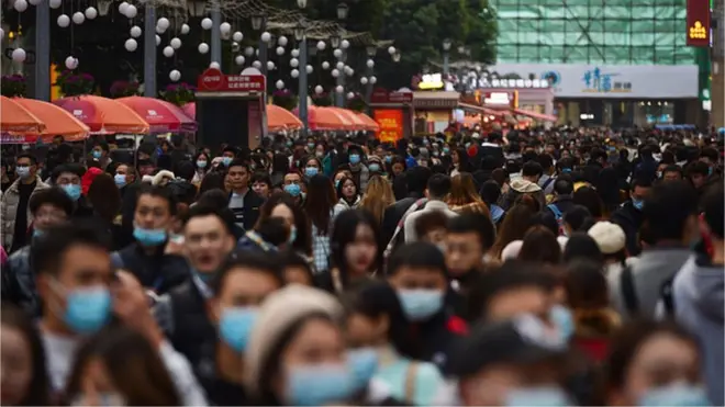 Pedestrians walk in Chengdu, China