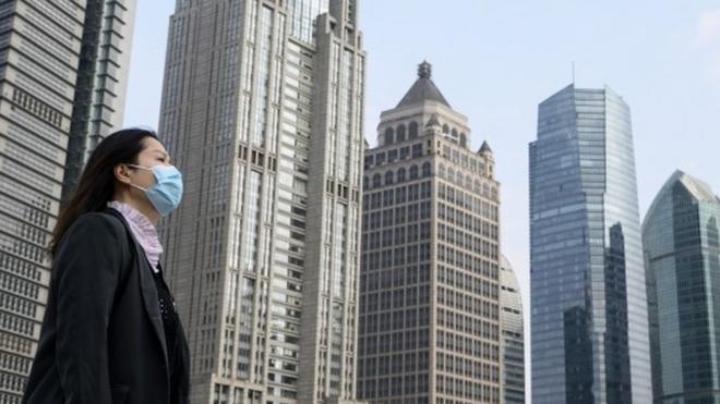 Woman wears a mask in Shanghai