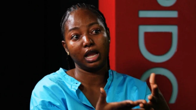 Wunmi Aloba on a sky blue dress wit teary eyes