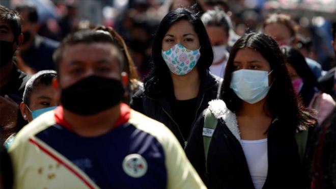 People wear masks in Mexico City