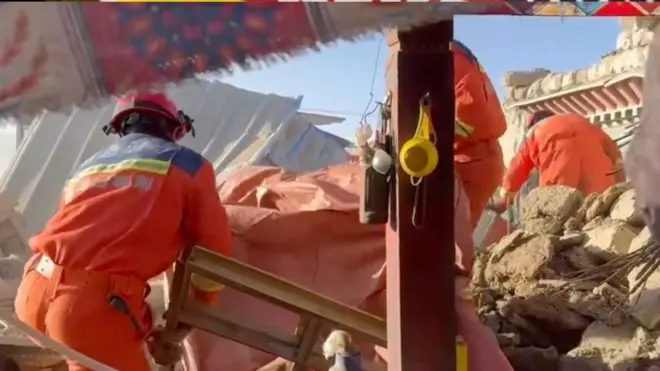 Rescuers work amid rubble in the aftermath of an earthquake in a location given as Shigatse City, Tibet Autonomous Region, China, on 7 January 2025, in this screengrab obtained from a handout video. 