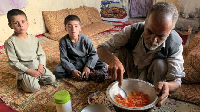 Hashmatullah and his sons live almost entirely off stale bread with onion and tomatoes