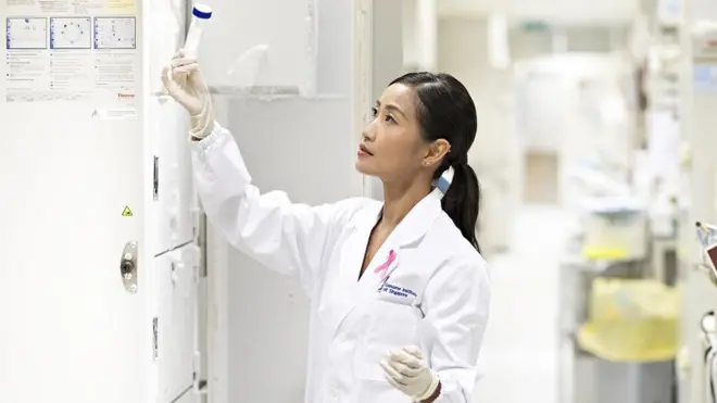 Dr Jingmei Li hold test tube for her laboratory.