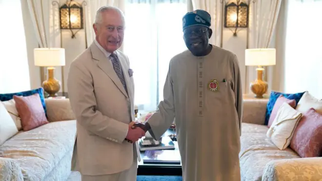 King Charles III and Nigeria President Bola Tinubu shake hand
