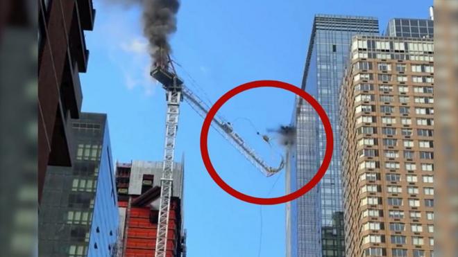 Crane crashes into building
