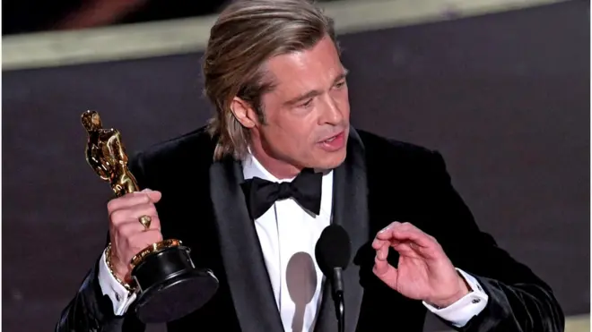 Brad Pitt with his Oscar for best supporting actor