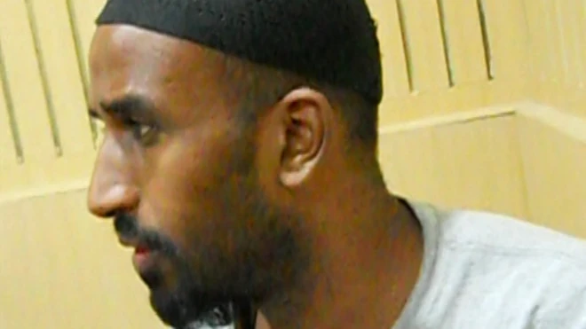 Police have released images of Mohammed Ali Ege while he was in police custody in India in 2013