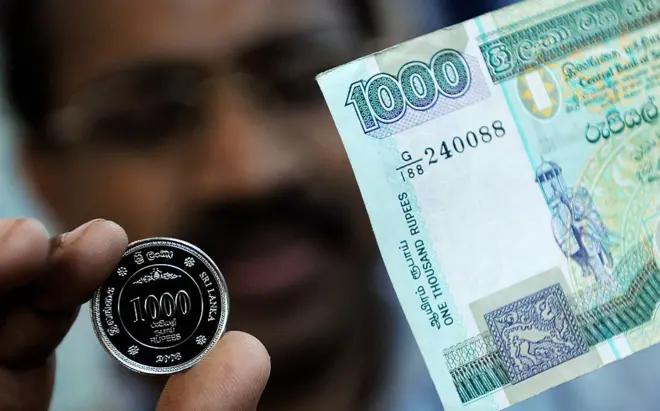 Thousand rupee note and coin