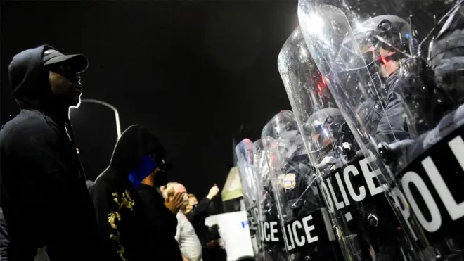 Demonstrators clash with riot police during a rally after the death of Walter Wallace Jr., a Black man who was shot by police in Philadelphia, Pennsylvania, US, 27 October 27, 2020.