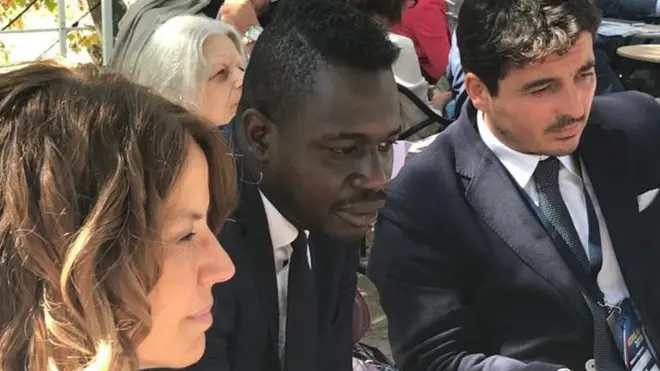 Dop (C) leads a session about migration