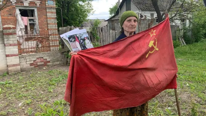 grandmother with red flag