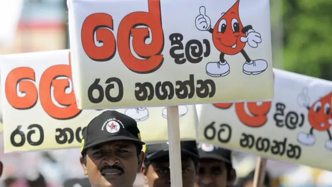 Sri Lankan volunteers carry placards encouraging blood donations during a march in Colombo on June 14, 2009, held to mark World Blood Donation Day. Hundreds of activists took part in the march in a country where many volunteered to donate blood during heavy fighting between troops and Tamil Tigers that ended in May after nearly four-decades of ethnic bloodshed.