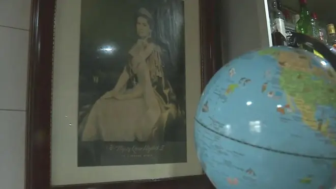 Globe and a picture of the Queen