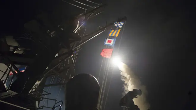USS Ross fires a tomahawk missile April 7, 2017, at a Syrian air force base