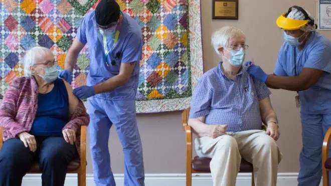 Beverly Coburn and husband John both receive their first dose of Moderna vaccine