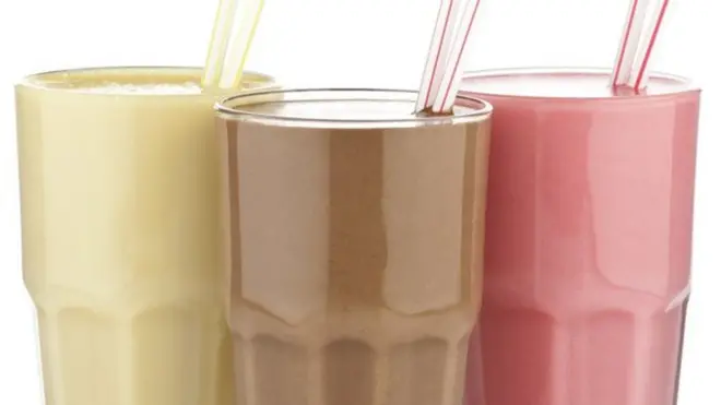 Glasses of different flavoured shakes