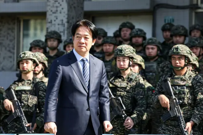 Taiwan's President Lai Ching-te inspects the troops taking part in the Rapid Response Exercise during a visit at the Songshan military airbase in Taipei on March 21, 2025.