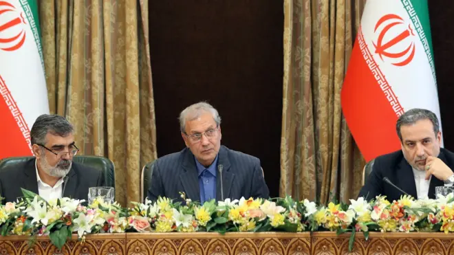 Behrouz Kamalvandi, left, Ali Rabiei, centre, and Abbas Araqchi, right, address the press