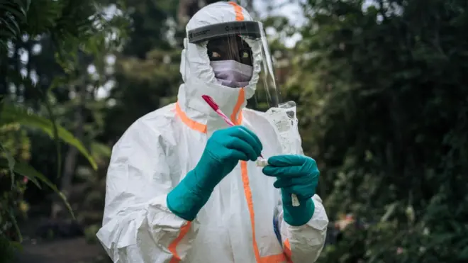 A staff member of the Congolese Ministry of Health prepares the sampling equipment to perform a COVID-19 test at a private residence in Goma, northeastern Democratic Republic of Congo, on March 31, 2020