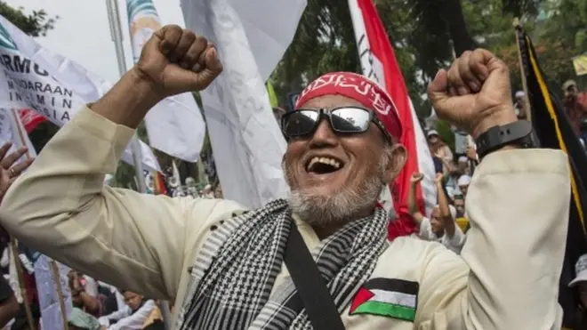 Hardline Muslim groups celebrated the jailing of the governor outside the court