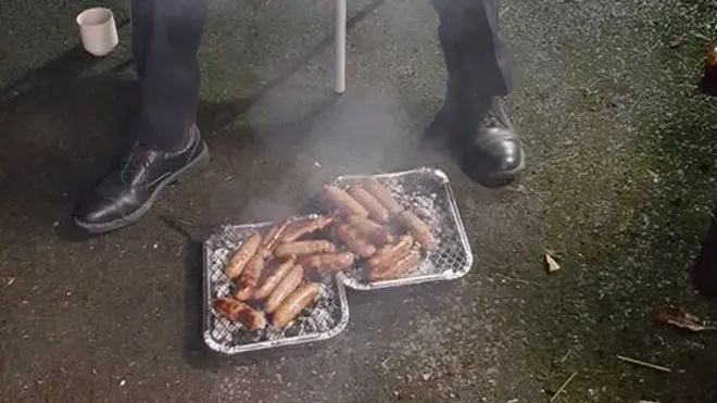 Firefighters celebrated their reward by putting the sausages on a barbecue