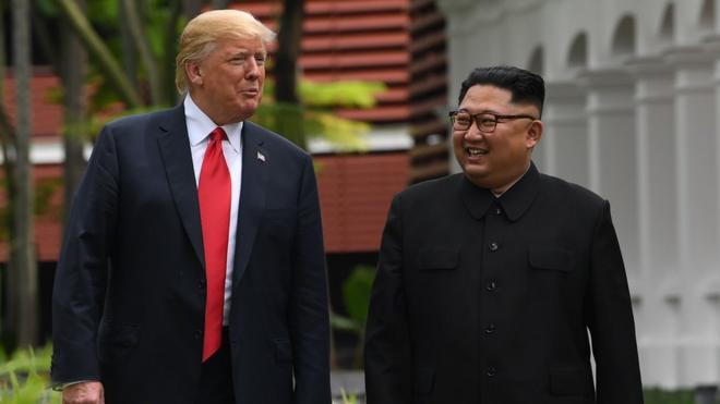 In this file photo taken on June 11, 2018 North Korea"s leader Kim Jong Un (R) walks with US President Donald Trump (L) during a break in talks at their historic US-North Korea summit, at the Capella Hotel on Sentosa island in Singapore.