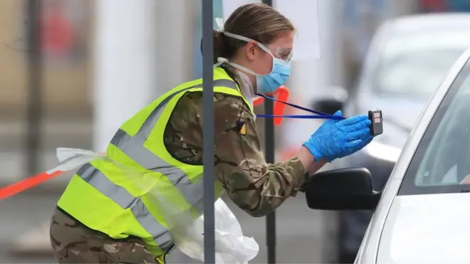 A soldier carries out a test