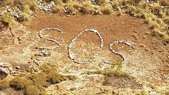 An SOS signal made out of rocks was found in the Australian outback