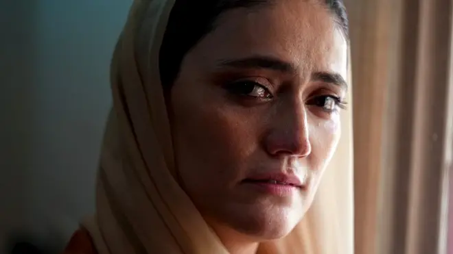 Wahida looks to the camera