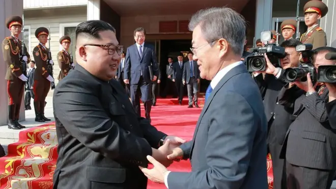 This photograph taken on May 26, 2018 and released by North Korea"s official Korean Central News Agency (KCNA) on May 27 shows South Korea"s President Moon Jae-in (R) shaking hands with North Korea"s leader Kim Jong Un after their second summit at the north side of the truce village of Panmunjom in the Demilitarized Zone (DMZ). Kim Jong Un believes a summit with US President Donald Trump will be a landmark opportunity to end decades of confrontation, South Korea"s President Moon Jae-in said May 27 following his surprise meeting with the North Korean leader. / AFP PHOTO / KCNA VIA KNS /
