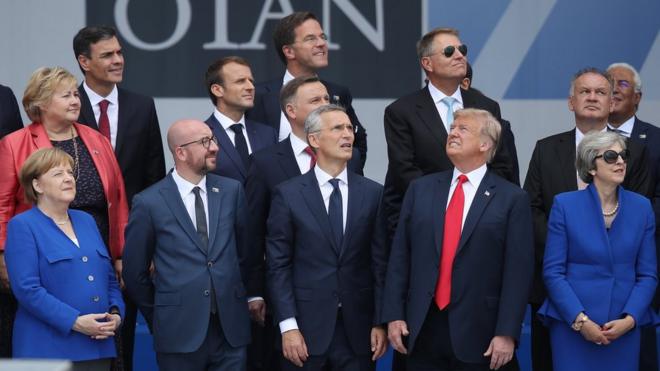 Nato leaders watch a fly-past at the start of the Brussels summit