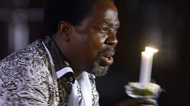 Nigerian pastor TB Joshua speaks during a New Year's memorial service for the South African relatives of those killed in a building collapse at his Lagos megachurch on December 31, 2014