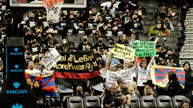 Protesters gather at a basketball game in New York