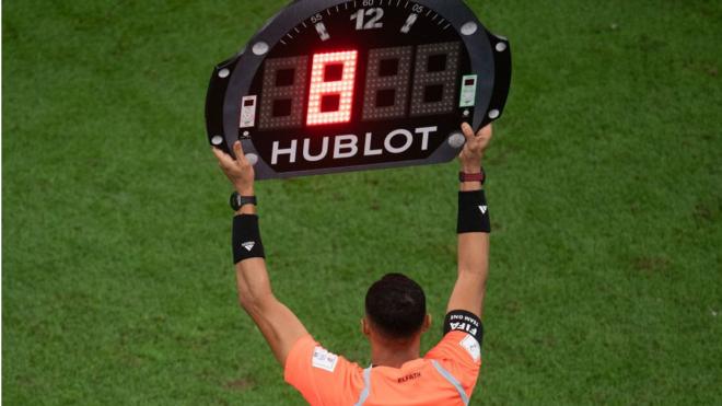 A fourth officials shows the amount of added time at the 2022 World Cup
