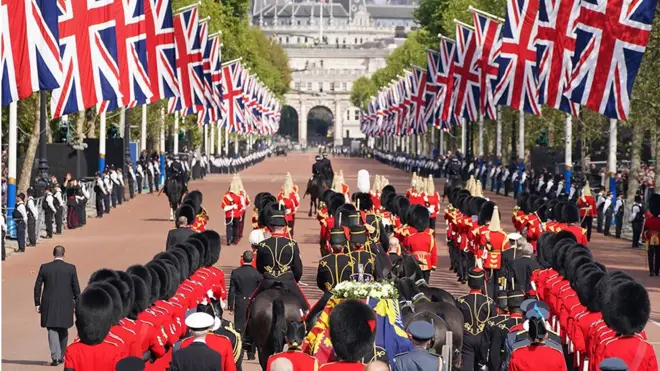King Charles III and members of the royal family behind Queen Elizabeth II's flag-draped coffin as it is taken in procession on a Gun Carriage of The King's Troop Royal Horse Artillery from Buckingham Palace to Westminster Hall on 14 September 2022