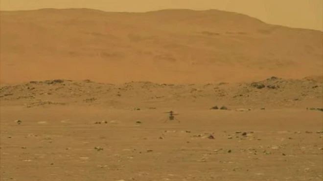 Frames from a video show Ingenuity hovering above the Martian surface