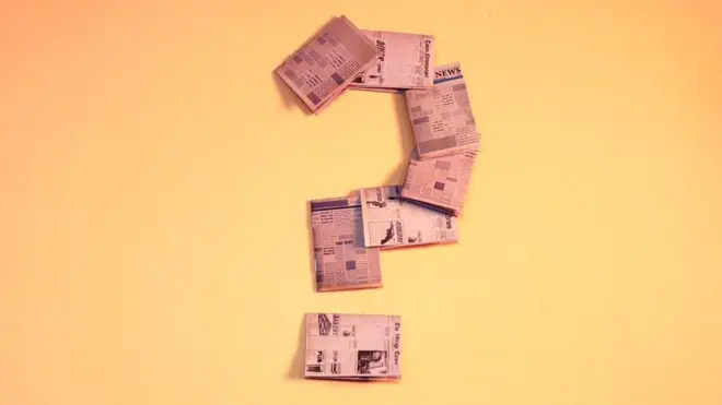 Question mark made out of newspaper