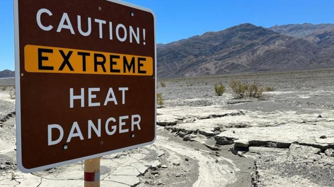 A sign in California's Death Valley reads "Caution! Extreme heat danger"