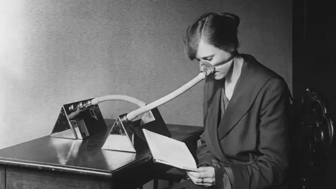 A woman wears a flu mask during the Spanish flu epidemic