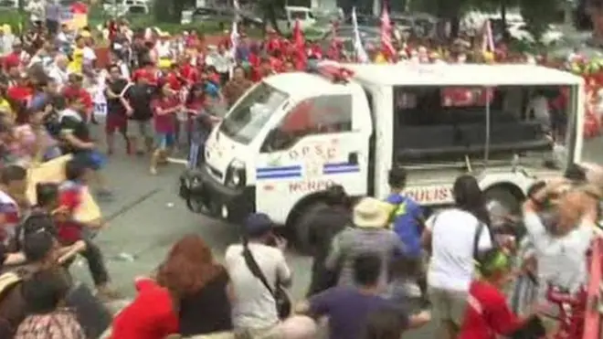 The police van hit several protesters outside the embassy