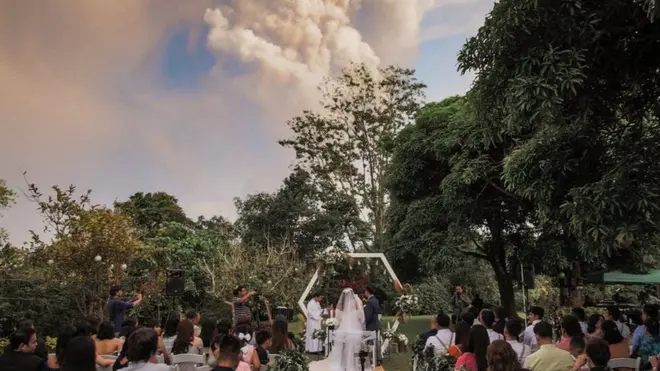 Wedding photo with volcano in the background