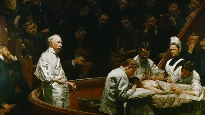 This oil is The Agnew Clinic (1889), by Thomas Eakins, which is compared to The Clinic of Gross because it represents a cleaner operating room, with participants in "white coats." Later, hygienic measures would become more drastic