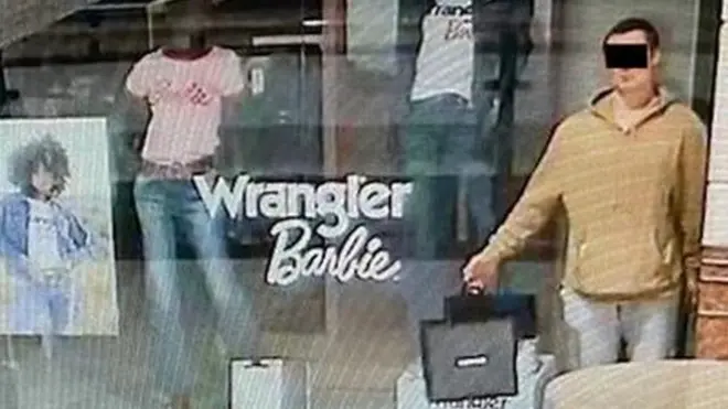 The man stood still in the front window before stealing jewellery