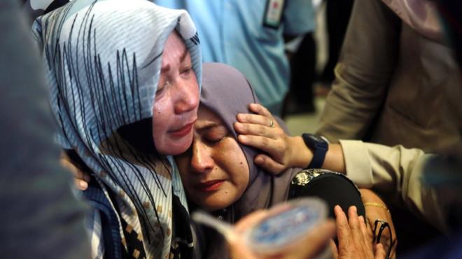 Indonesian relatives of the plane crash victims cry as they wait for the news at the airport in Pangkal Pinang, Indonesia, 29 October 2018.